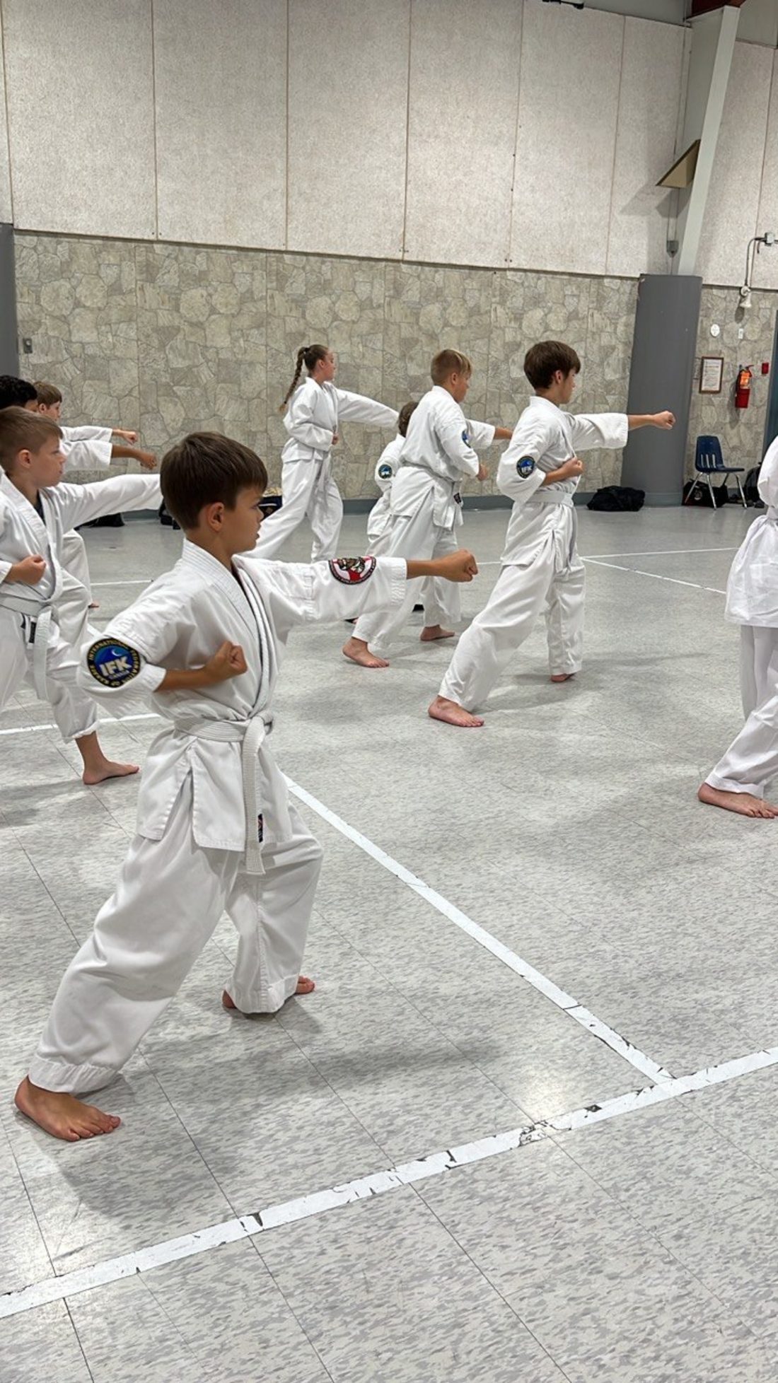 Young students practicing basic karate techniques (kihon) at Winterpeg Dojo